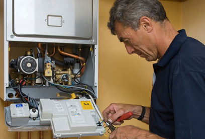 man fixing boiler